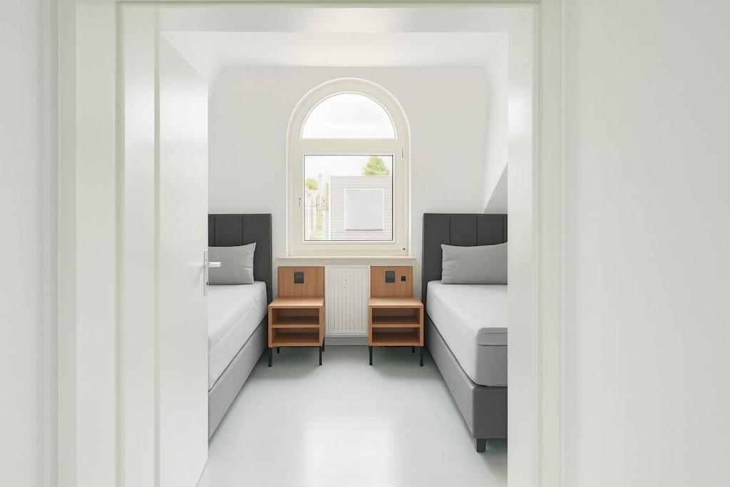 Zweites Schlafzimmer mit 2 Einzelbetten im Apartment 3 in Herten